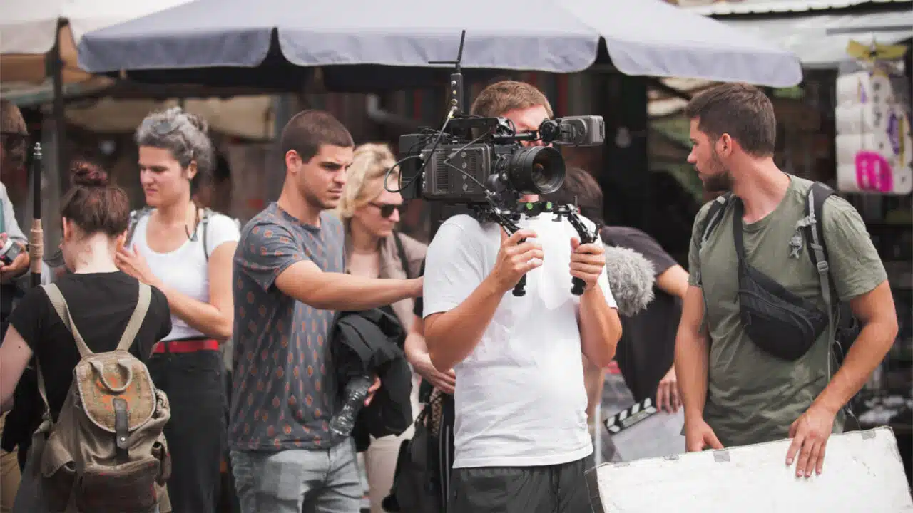 Film crew shooting on outdoor location